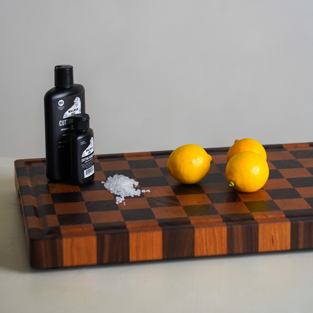 Chopping board with lemons and salt sitting on top
