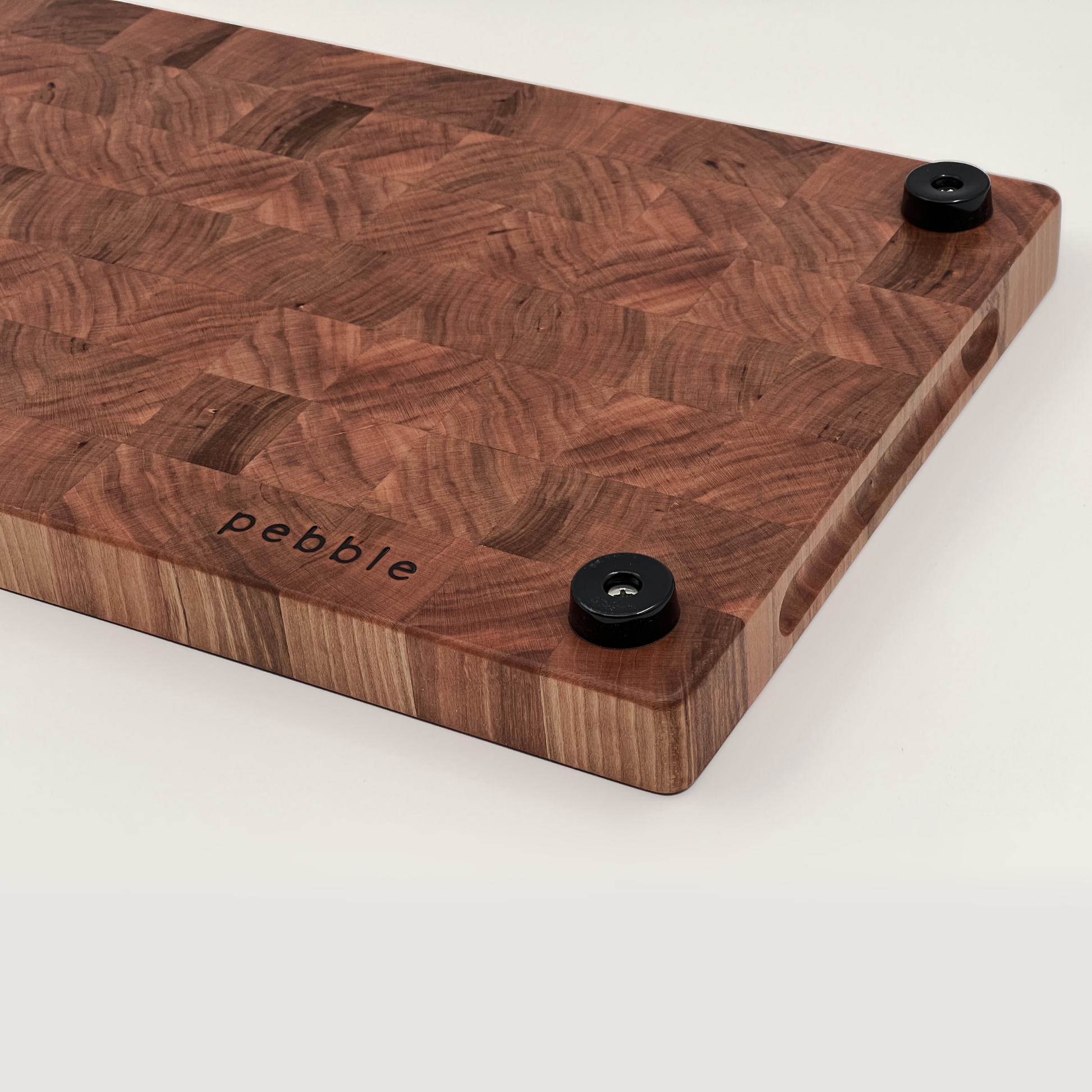 Bottom of chopping board showing the feet and Pebble logo