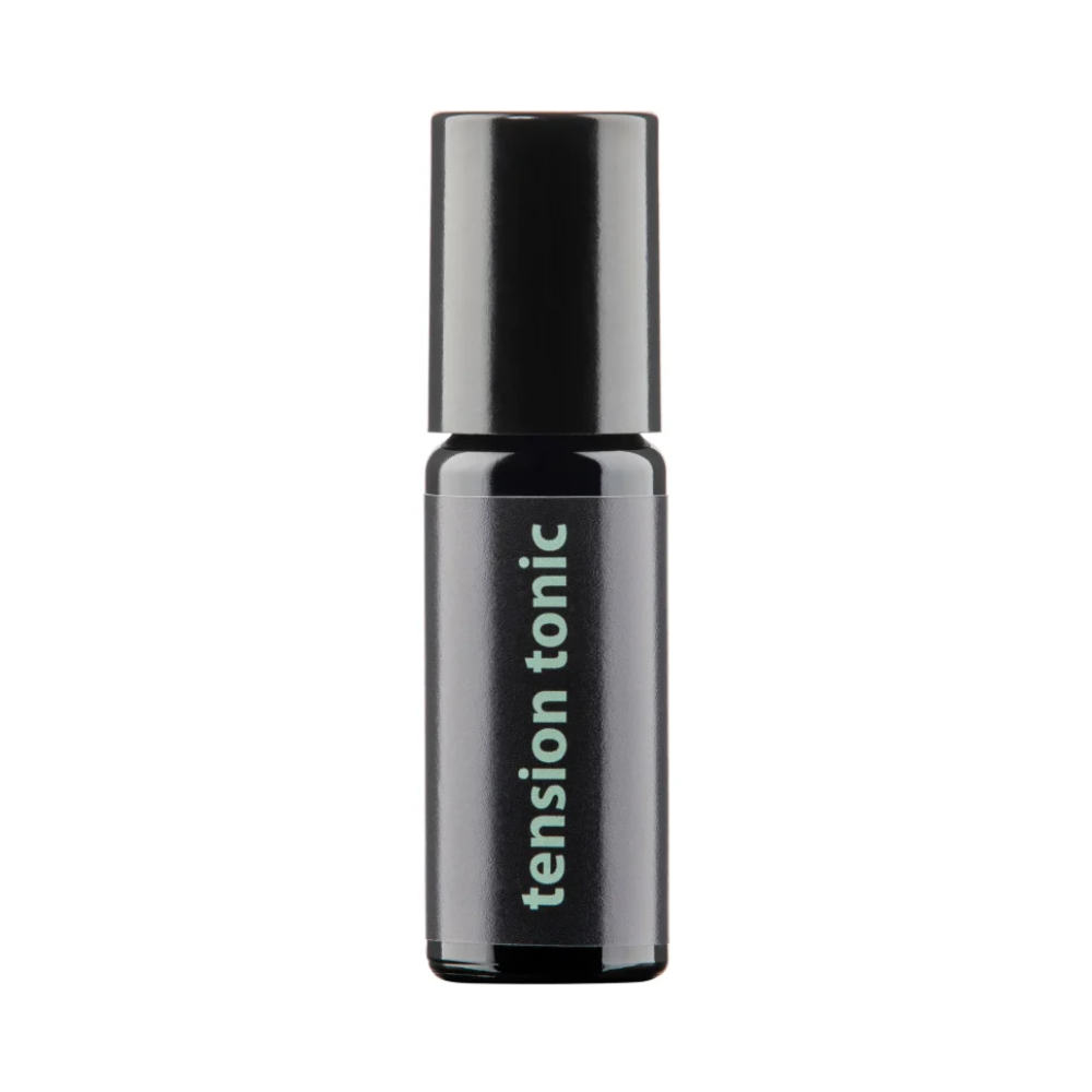 Black bottle of tension tonic on a white background