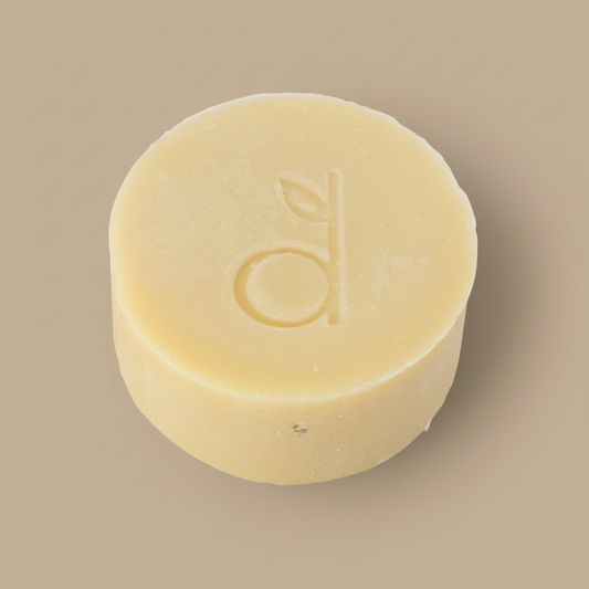Bar of soap with a logo on a beige background