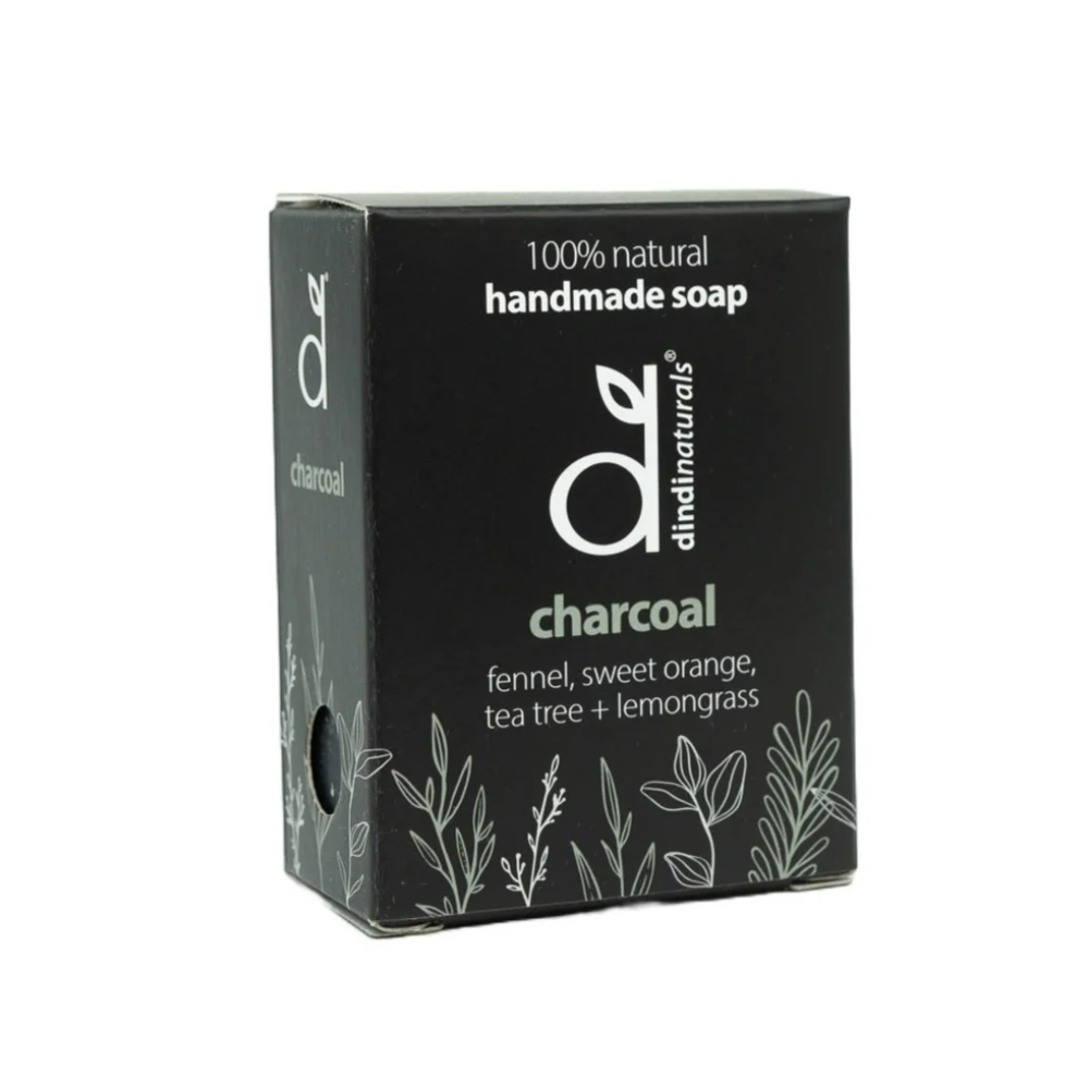 Black box of handmade charcoal soap with dindi naturals branding on a white background