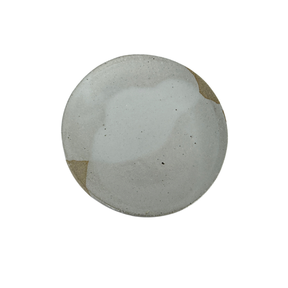 Round ceramic plate on white background