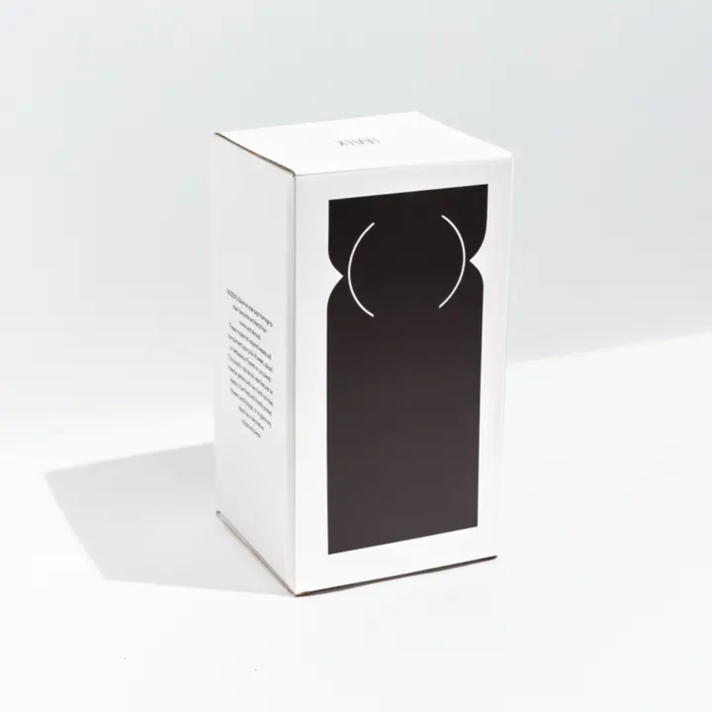 White packaging with a black silhouette of a vase on a white background