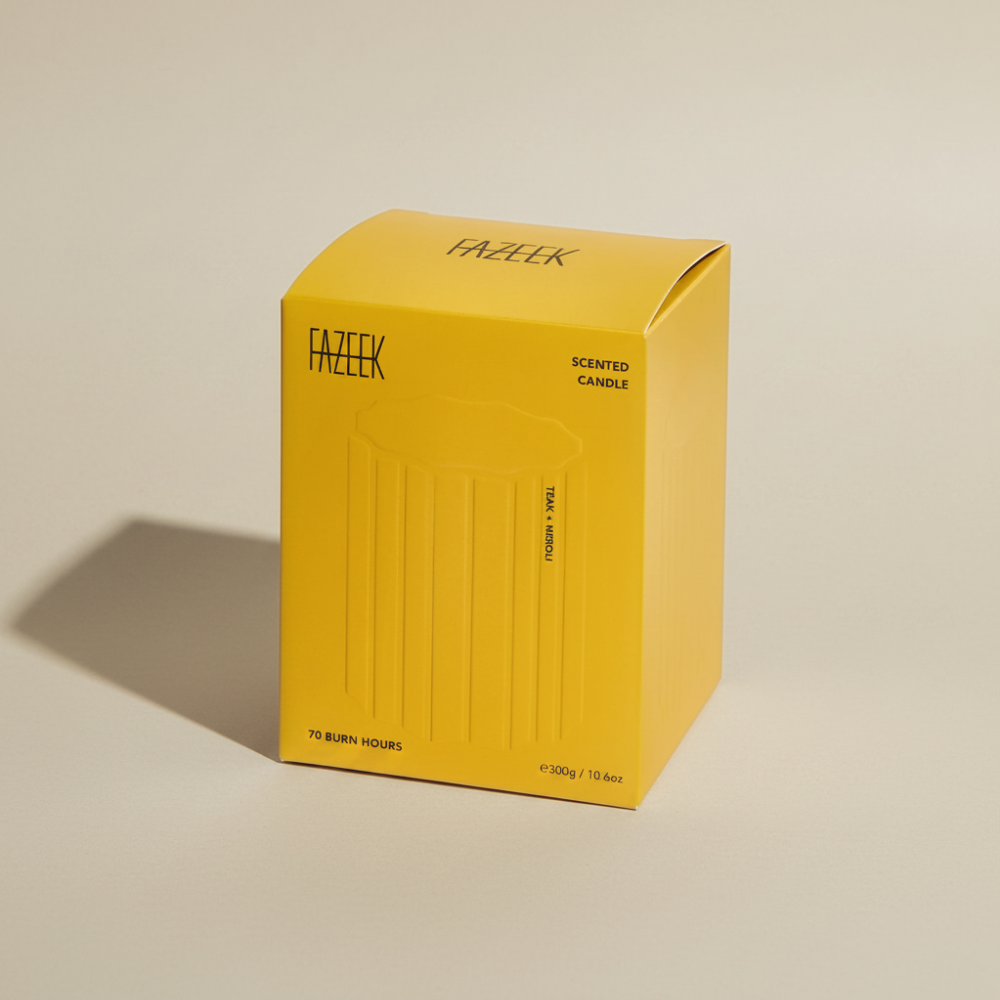 Fazeek Wave Candle with Teak and Neroli Scent in a yellow box on a beige background