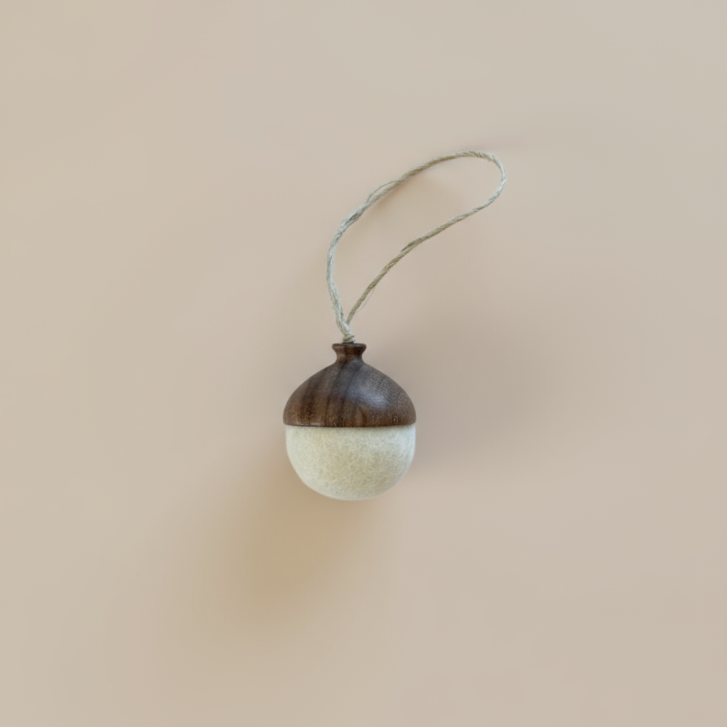 Hand turned walnut and white felt acorn ornament with jute loop. Australian Made natural Christmas decoration for slow living