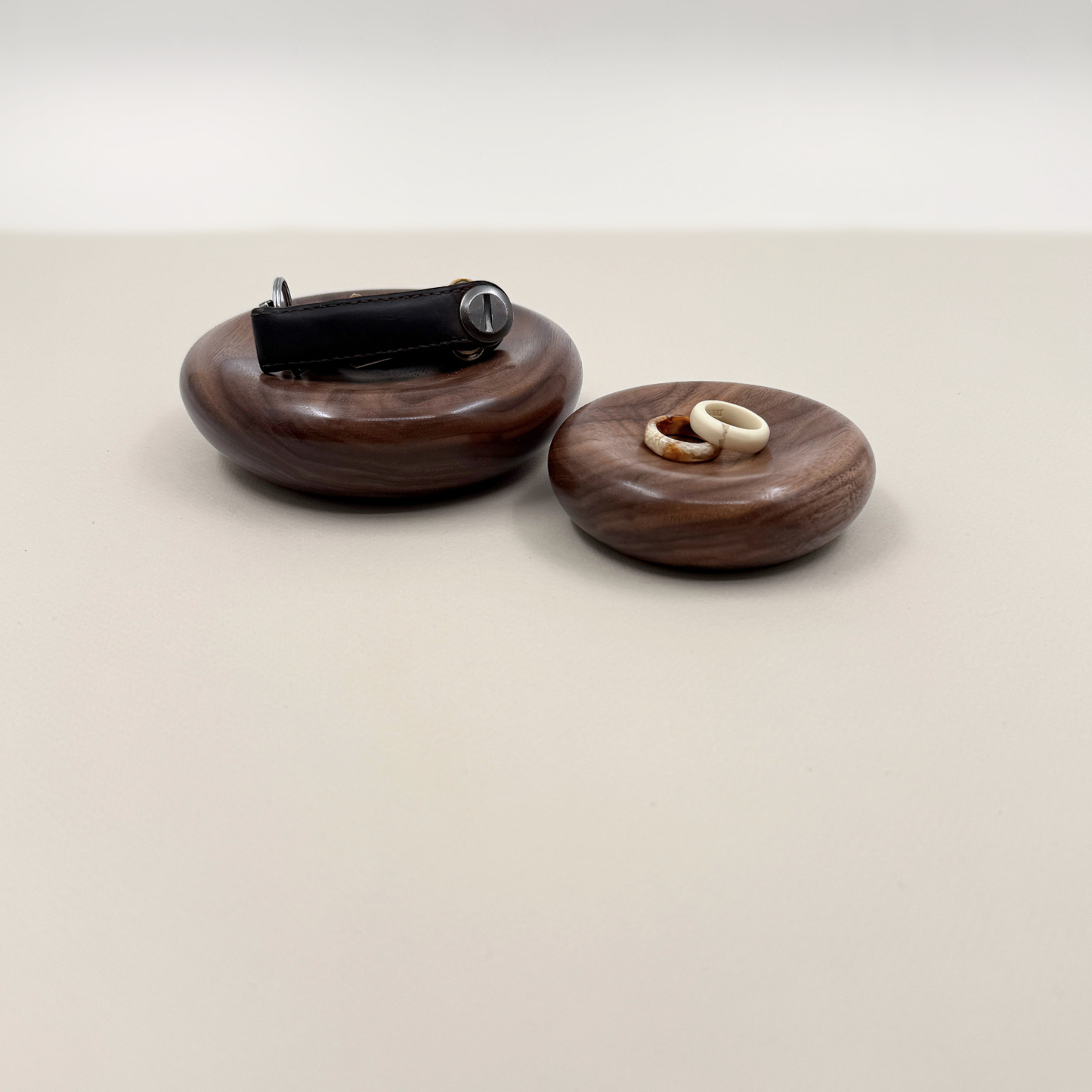 Two wood dishes holding keys and rings