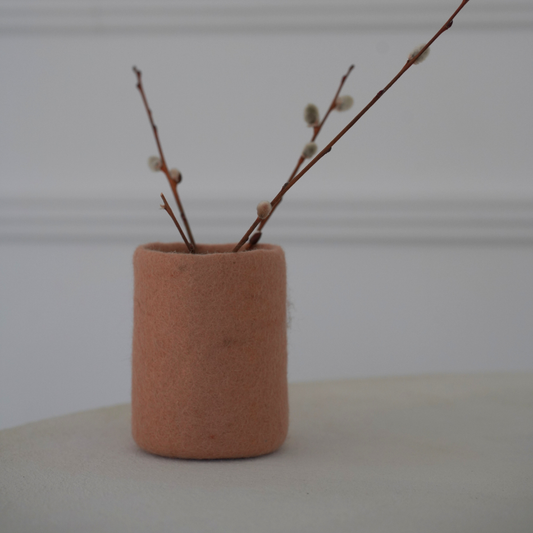 soft blush handcrafted wool storage on white background