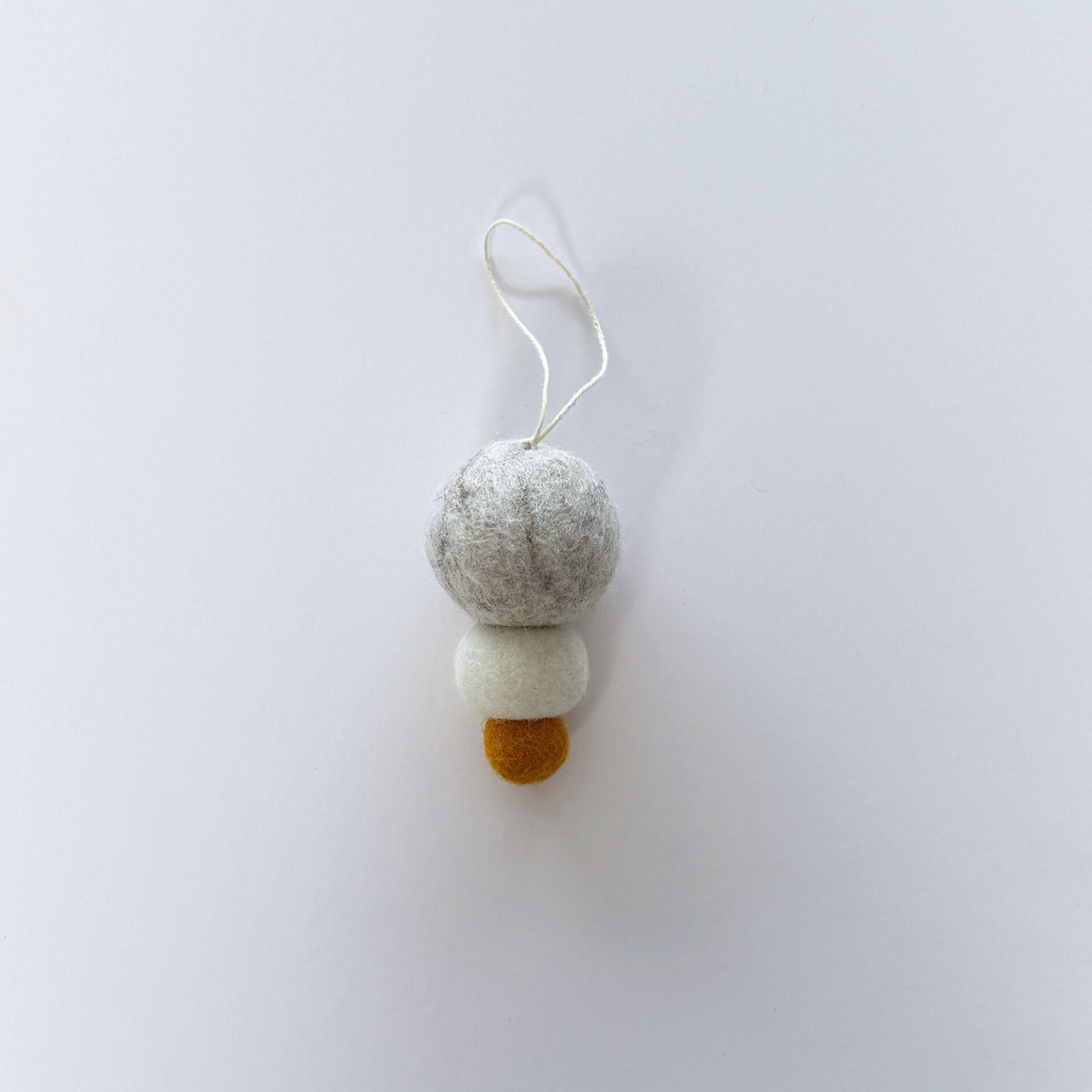 Pebble Studio felt Christmas decoration on a white background