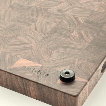 Bottom of a chopping board showing the feet and Pebble logo