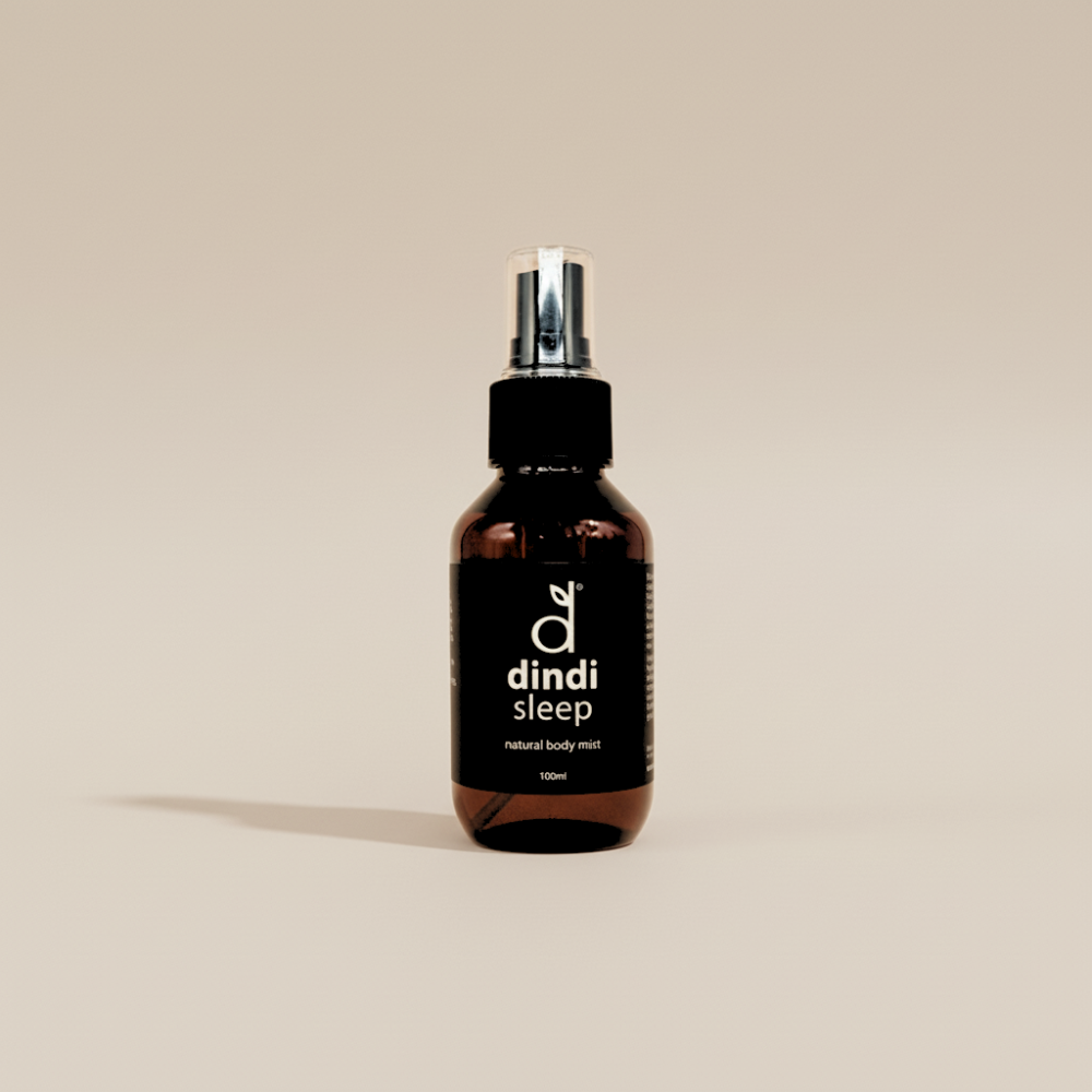 Bottle of dindi sleep natural body mist on a beige background