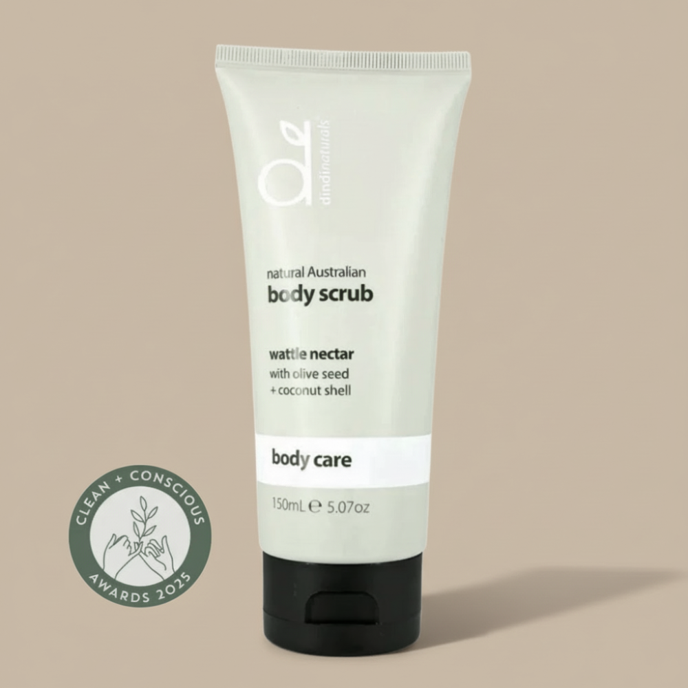 Bottle of body scrub on a light background