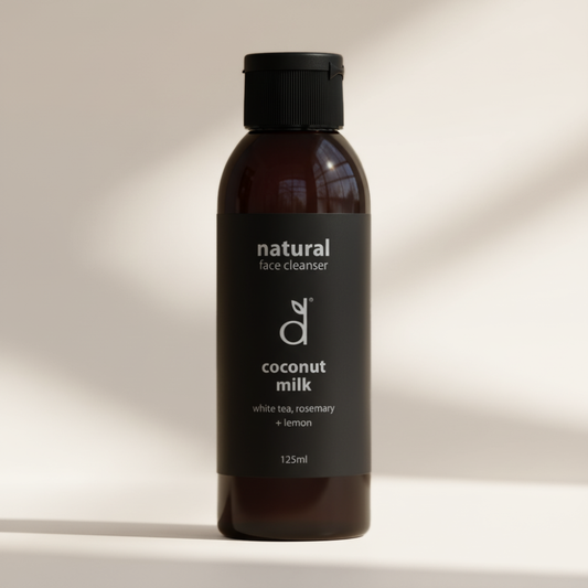 Bottle of Dindi Naturals natural coconut milk face cleanser on a neutral background