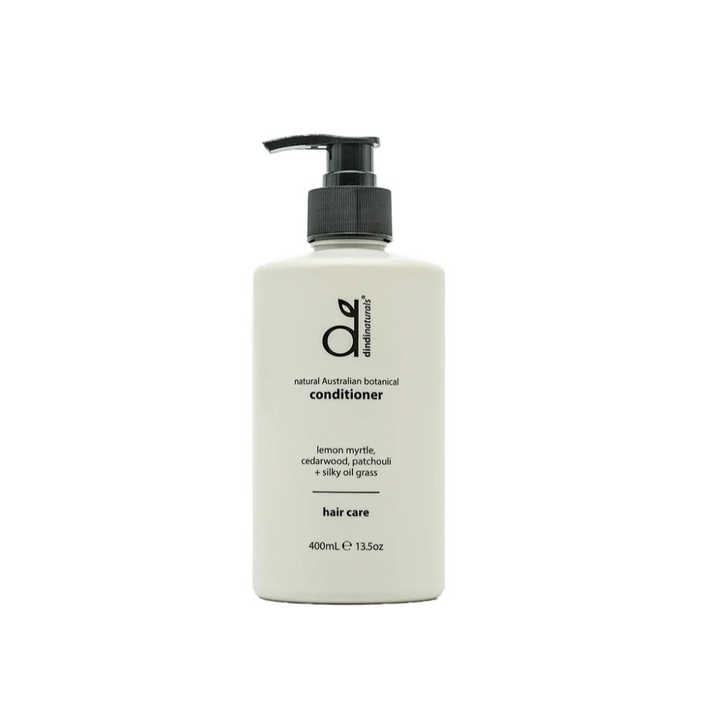 White bottle of conditioner with black pump on a white background