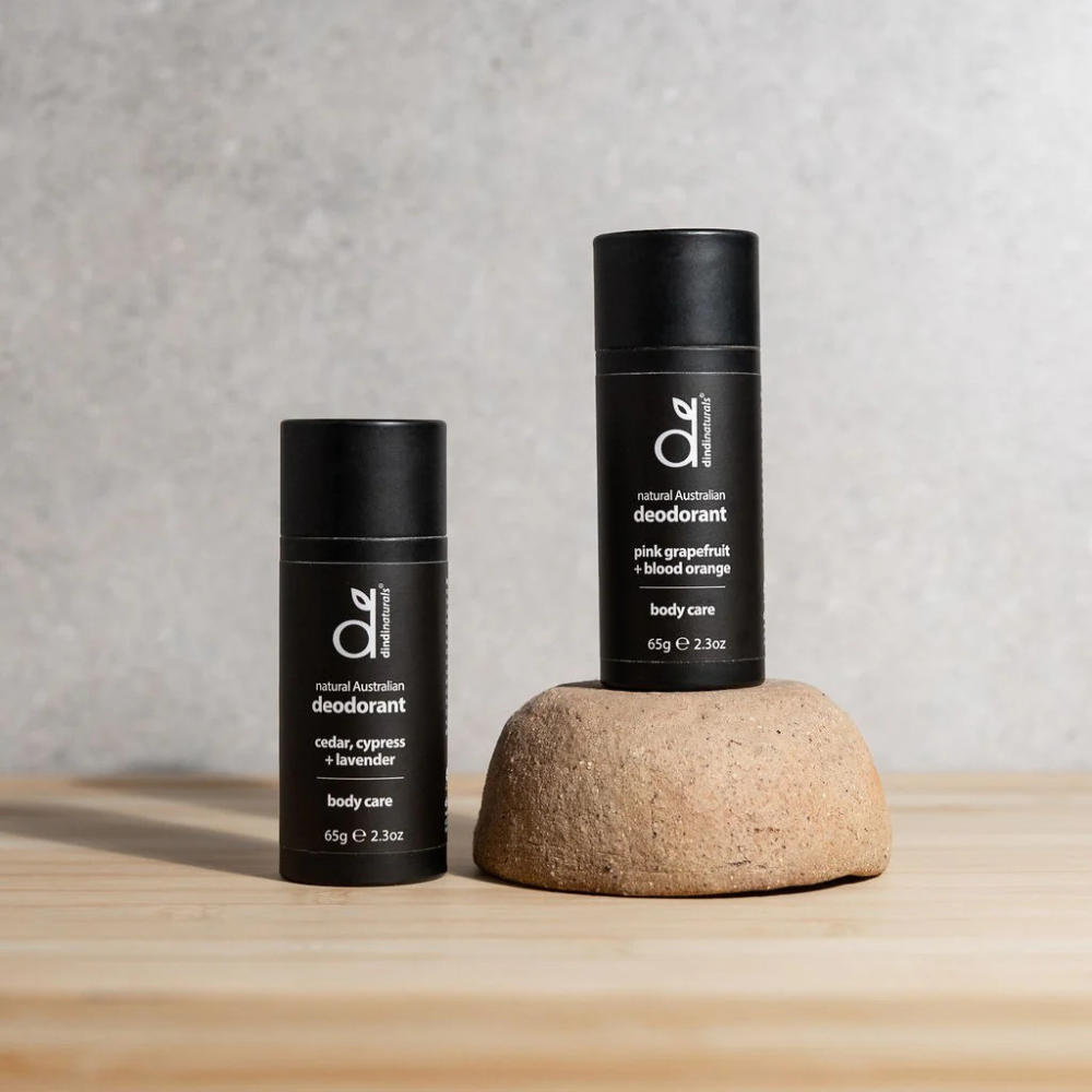 Two stick deodorants in a black packaging