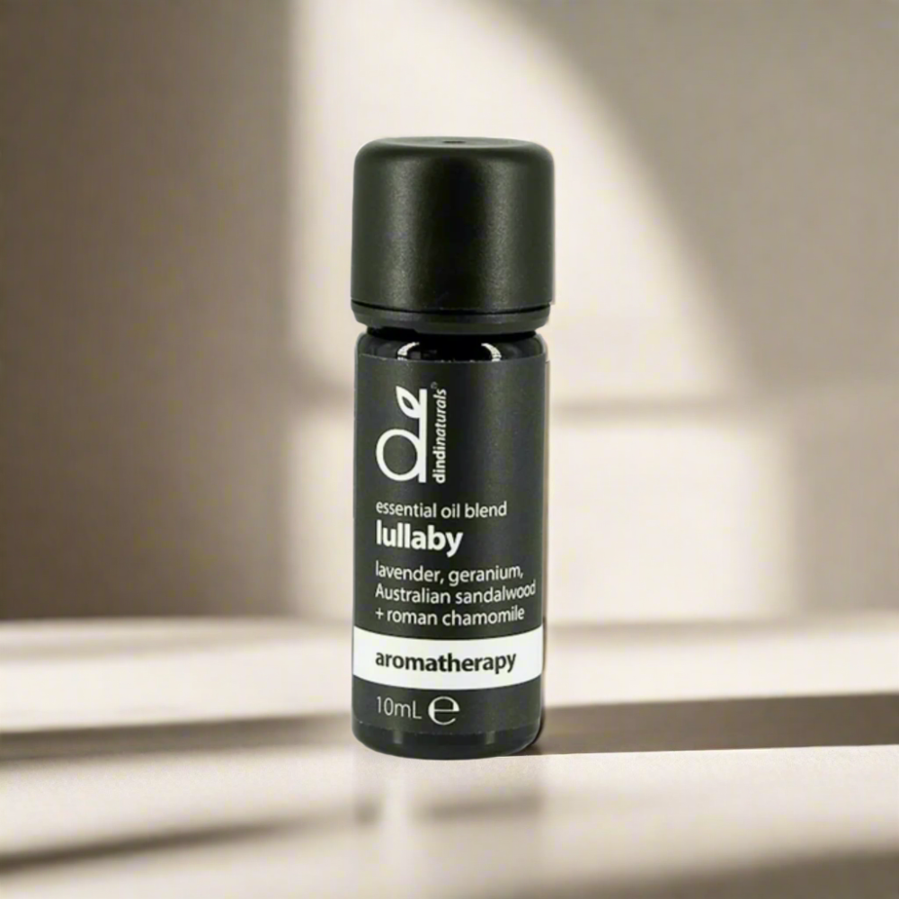 Black essential oil bottle labelled 'lullaby' on a neutral background