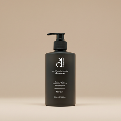 Black shampoo bottle on beige background