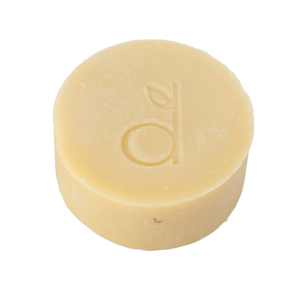 Yellow soap bar with a logo on a white background
