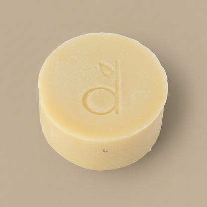 Bar of soap with a logo on a beige background