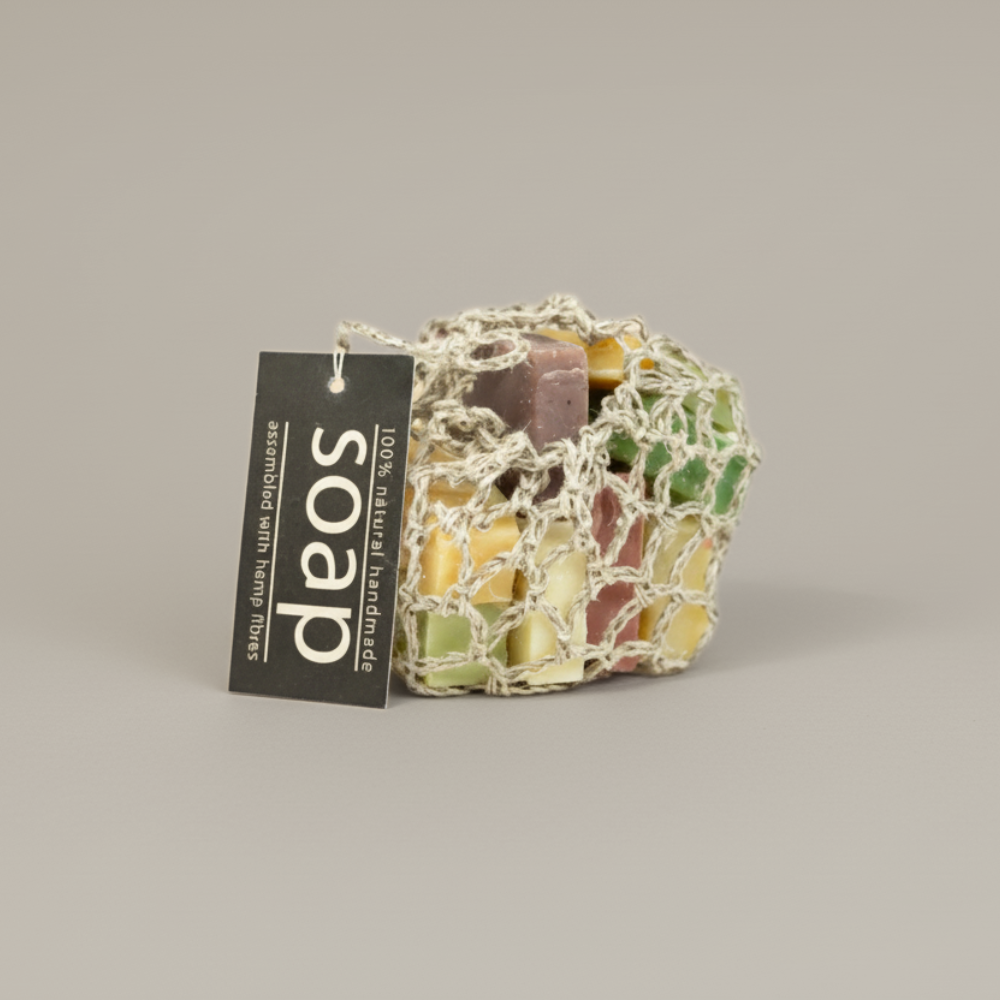 Colorful soap in a hemp bag with a 'soap' label on a beige background