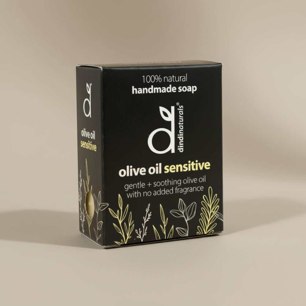 Box of dindi naturals olive oil sensitive soap on a beige background