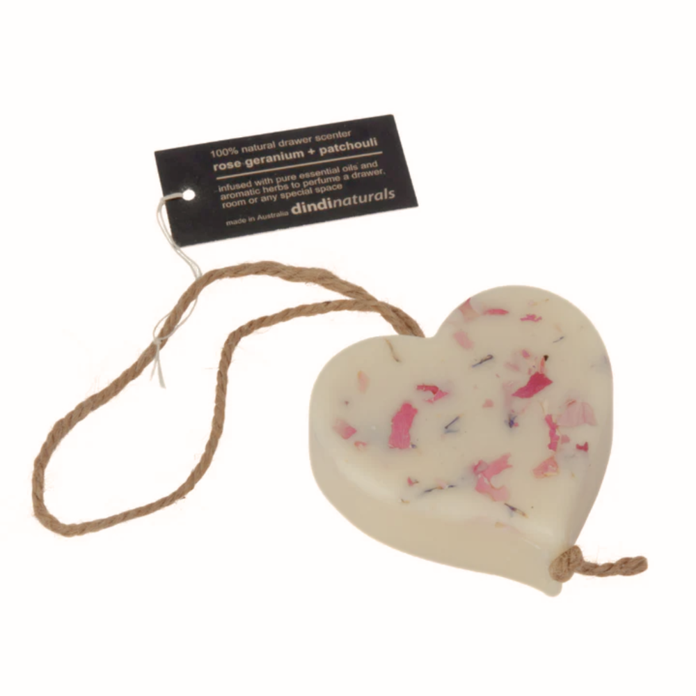 Heart-shaped scented wax on a rope with a Dindi Naturals tag on a white background