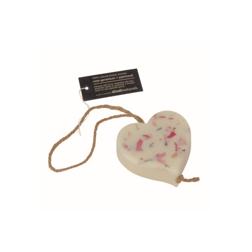 Heart-shaped scented wax on a rope with a label on a white background