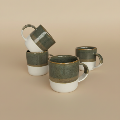 Four ceramic mugs styled on a light background