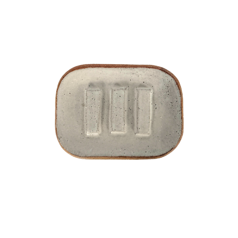 Rectangular ceramic soap dish with a speckled finish on a white background