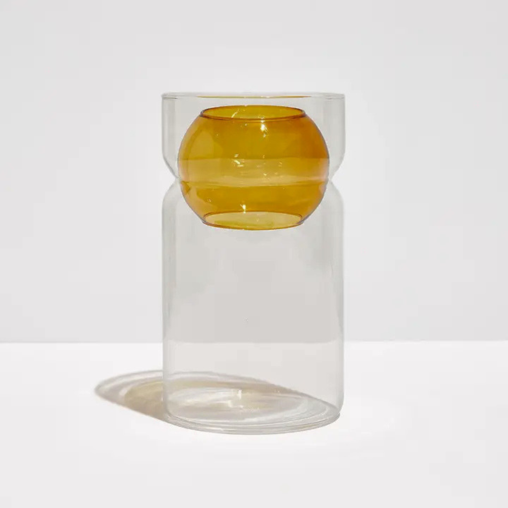 Fazeek clear glass vase with amber sphere insert on a light background