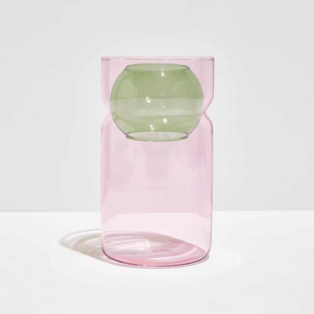 Fazeek pink glass vase with green sphere insert on a white background