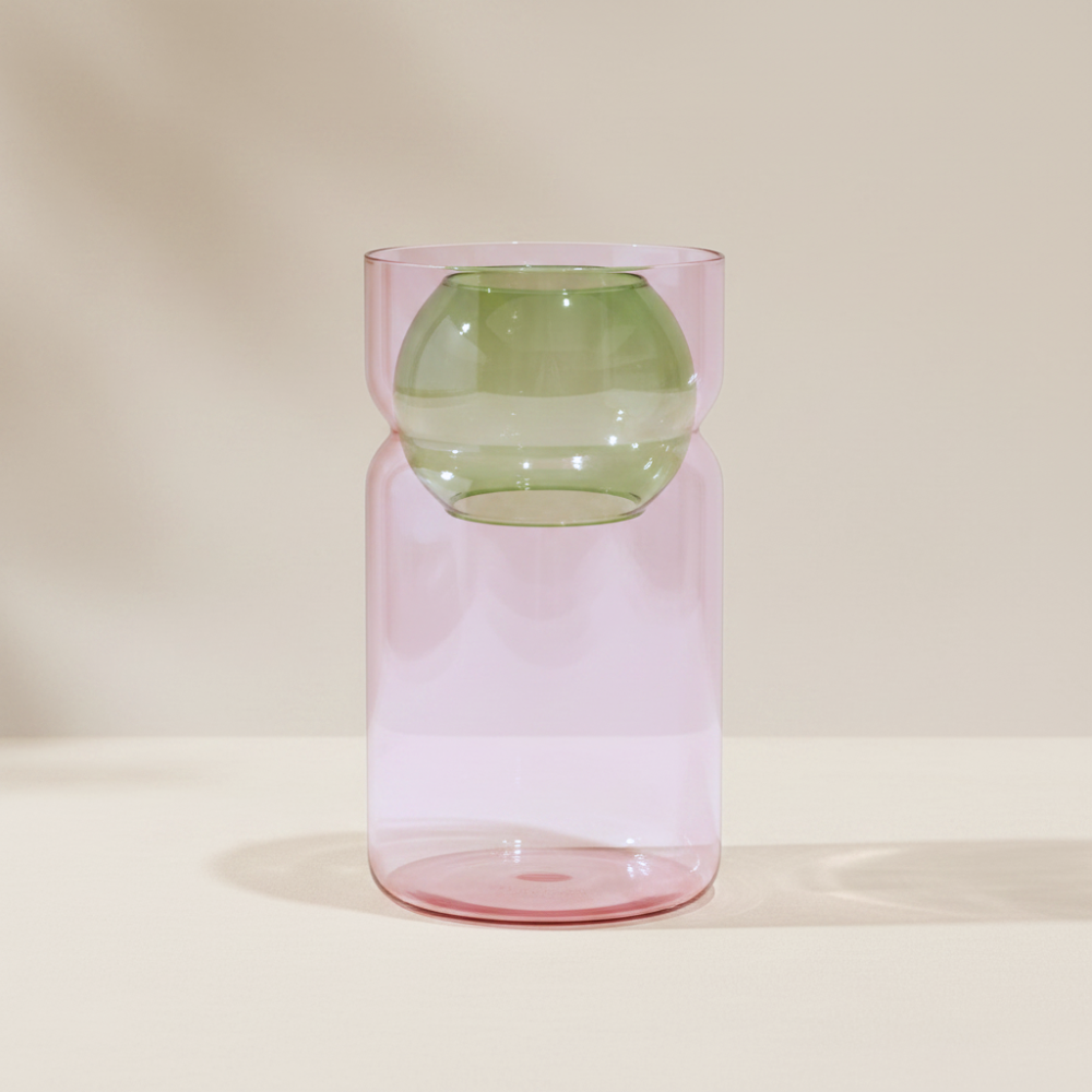 Fazeek pink glass vase with green sphere insert on a beige background