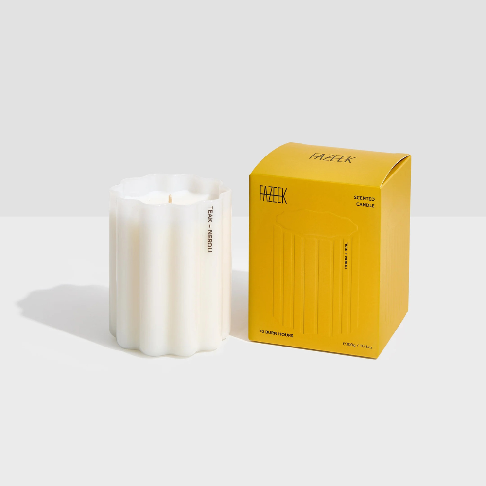 Fazeek Wave Candle with Teak and Neroli Scent next to a yellow box on a white background