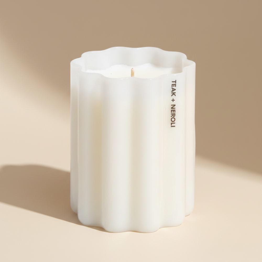 Fazeek Wave Candle with Teak and Neroli Scent on a beige background
