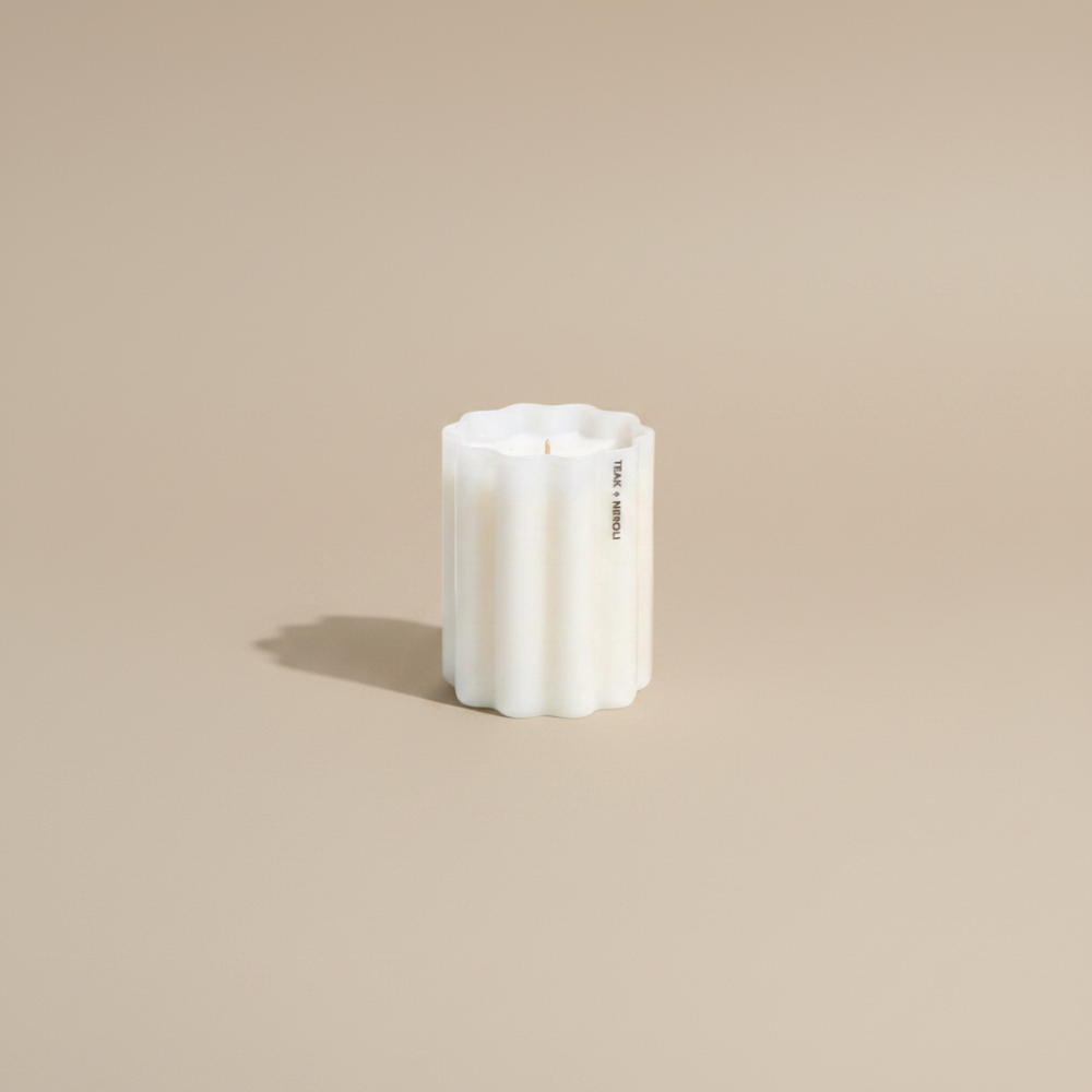 Fazeek Wave Candle with Teak and Neroli Scent on a beige background