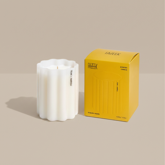 Fazeek Wave Candle with Teak and Neroli Scent next to a yellow box on a beige background