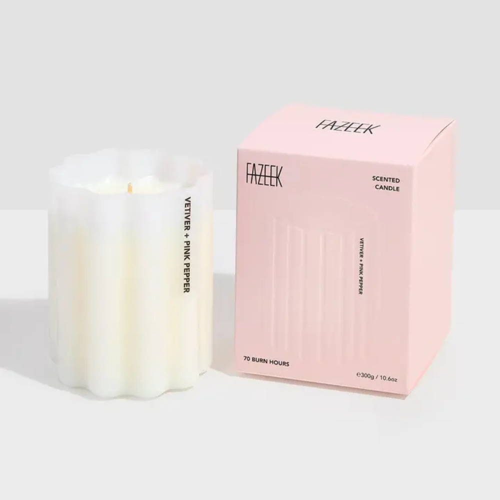 Fazeek Wave Candle with Vetiver and Pink Pepper scent sitting next to a pink canlde box on a white background