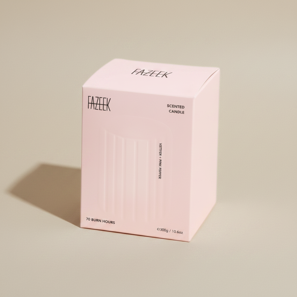 Pink box holding a Fazeek Wave Candle with Vetiver and Pink Pepper scent on a beige background