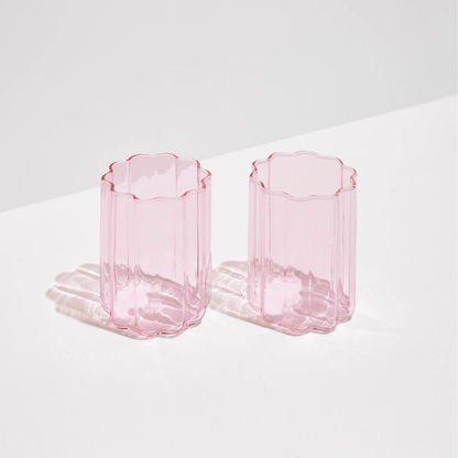 Two pink Fazeek wave glasses on a light background