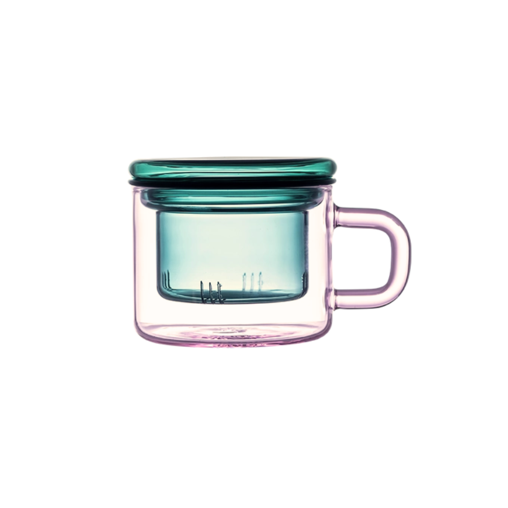 Glass mug with a green lid on a white background