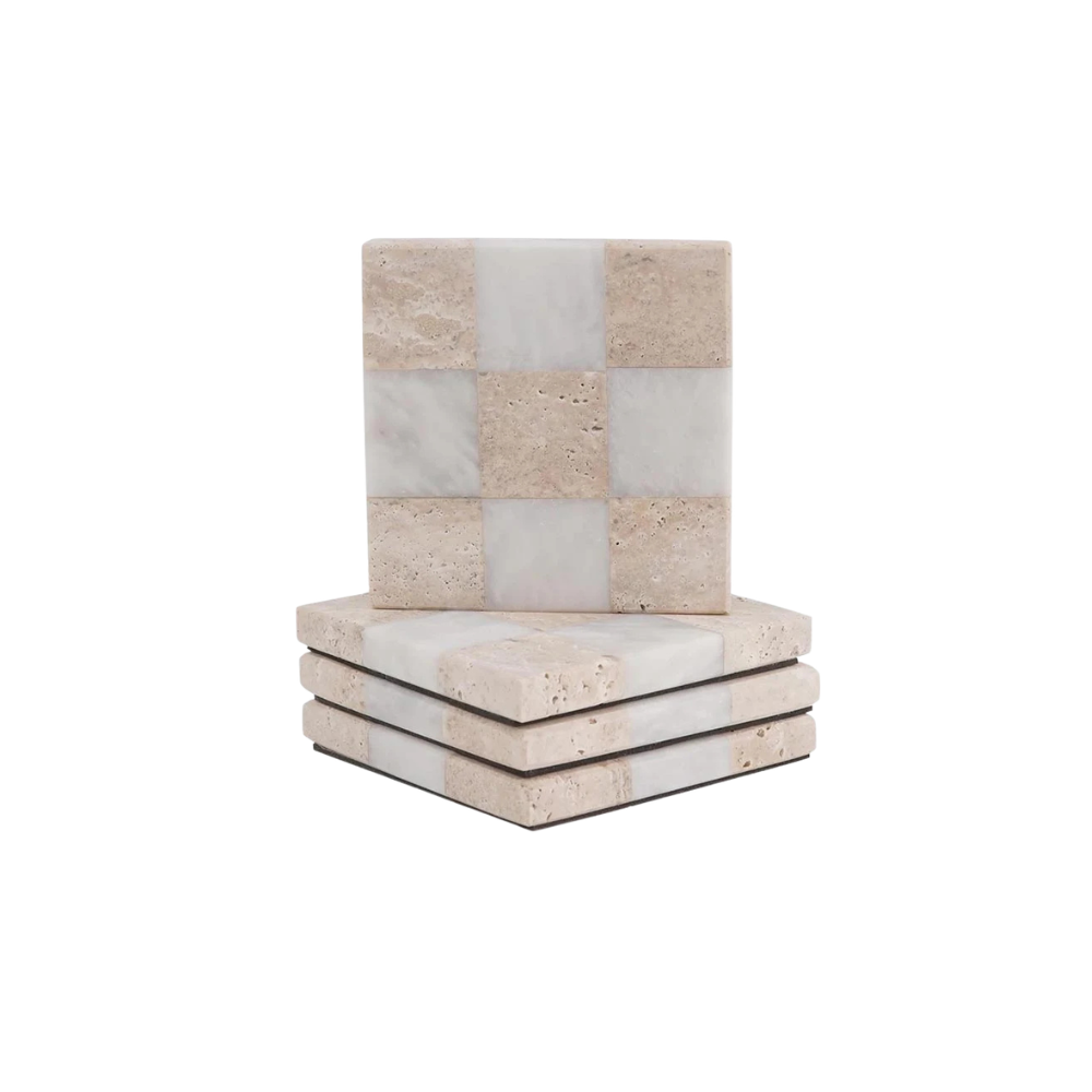 Stack of stone coasters with a checkered pattern on a white background