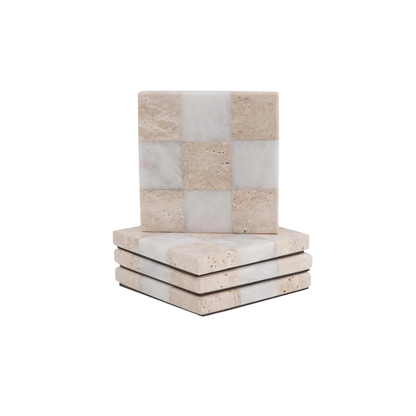 Stack of stone coasters with a checkered pattern on a white background