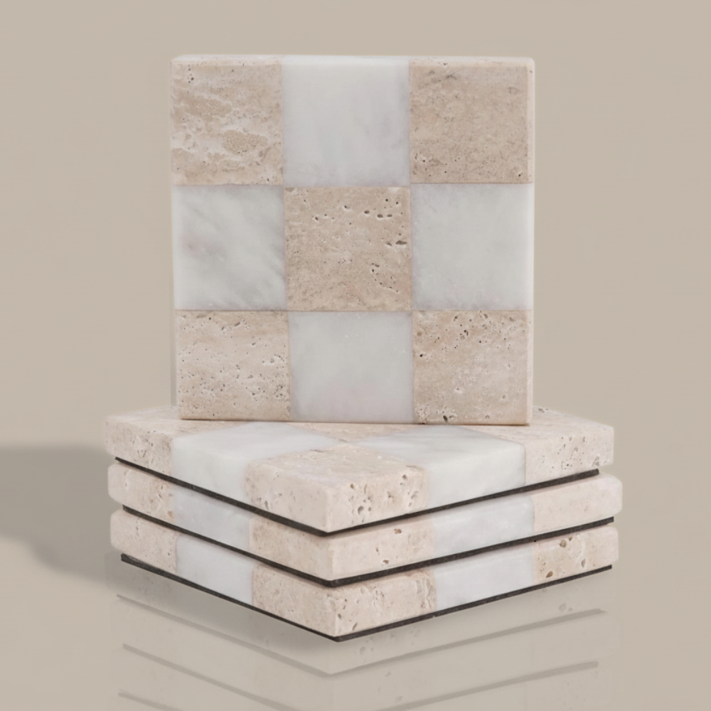 Stack of square stone coasters with a checkered pattern on a beige background