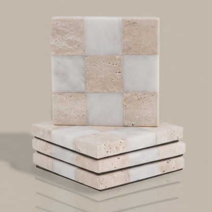 Stack of square stone coasters with a checkered pattern on a beige background