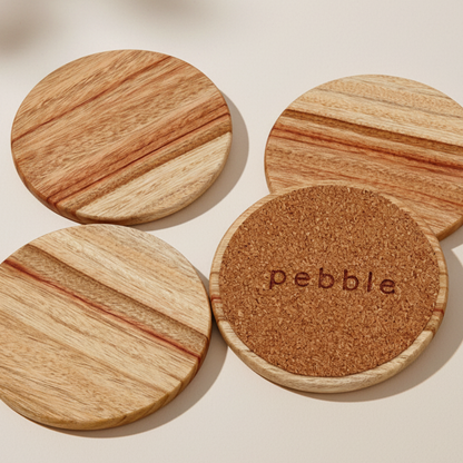 Wooden coasters with cork bottom on a beige background