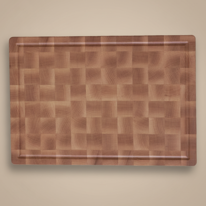 Wooden cutting board on a beige background