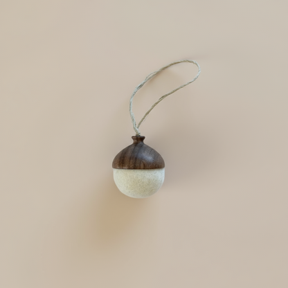 Hand turned walnut and white felt acorn ornament with jute loop. Australian Made natural Christmas decoration for slow living