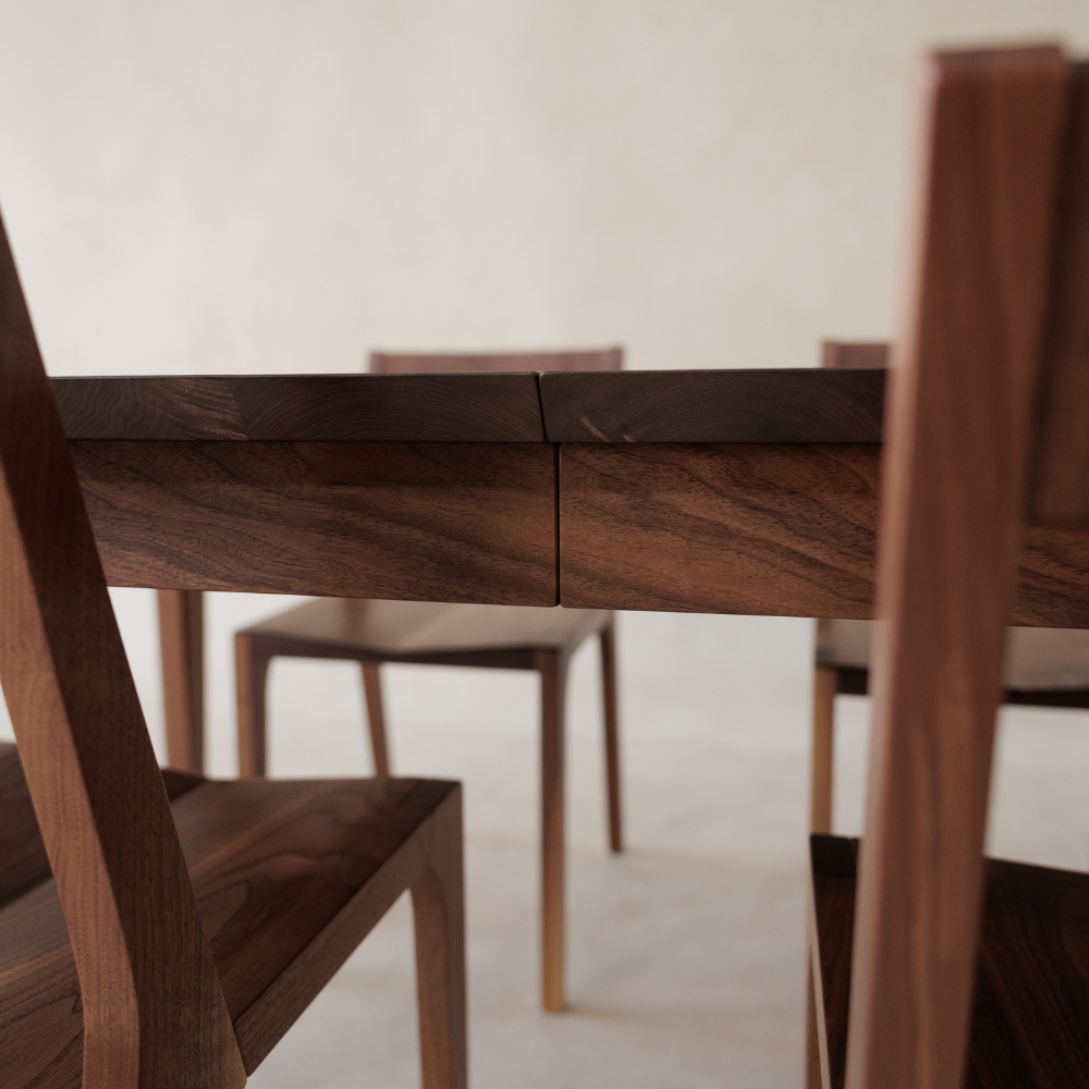 Wooden dining table with chairs in a minimalistic setting