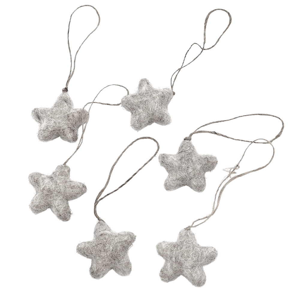 Six tiny felt star decorations on a light background