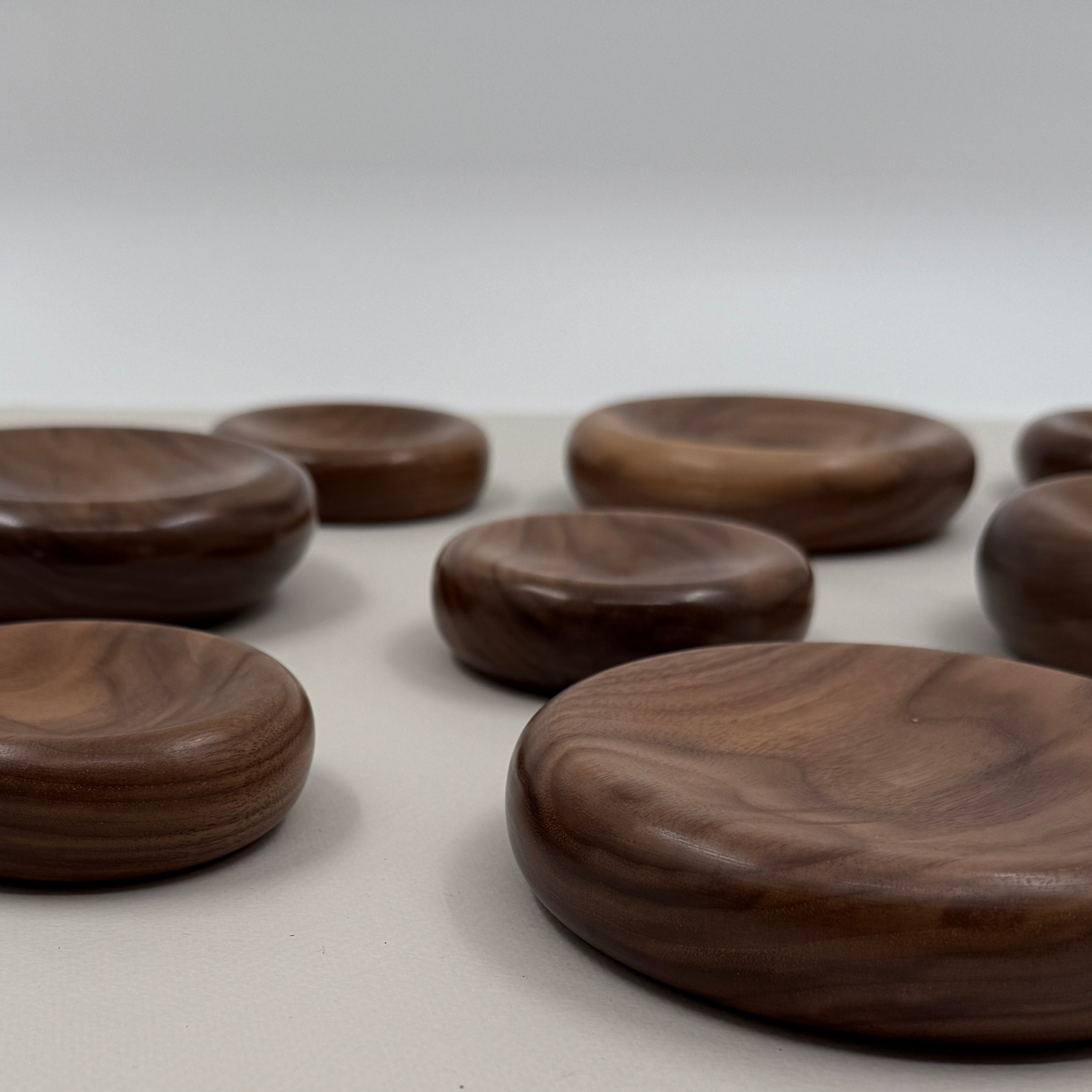 Wooden dishes on a light surface with a neutral background