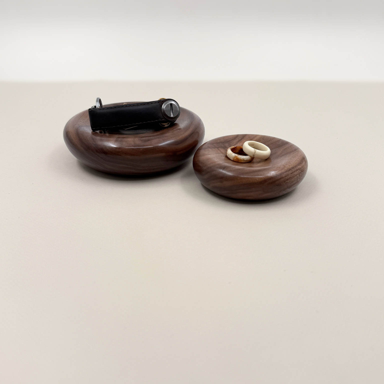 Two wood dishes holding keys and rings